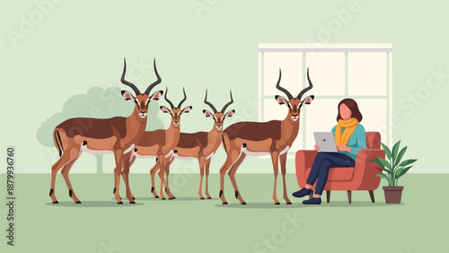 Antelopes gaze at woman on couch with laptop in a cozy room