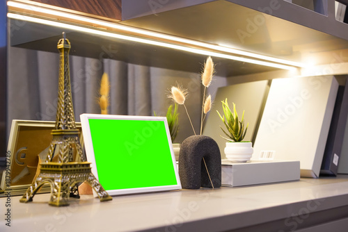Photography Modern shelf decor with books, small potted plants, framed photo, Eiffel Tower replica, and ambient lighting creating a stylish interior display