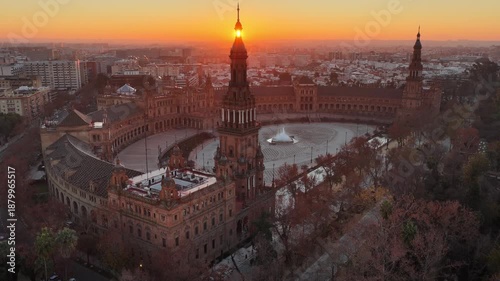 Sunrise drone view of Plaza de Espana, Spanish Square in Seville, Spain. Morning aerial view of Seville city and Plaza de Espana in Maria Luisa Park