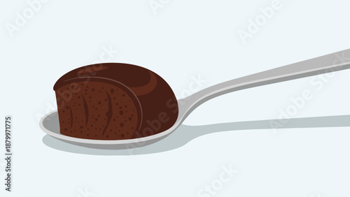Chocolate cake slice on a spoon