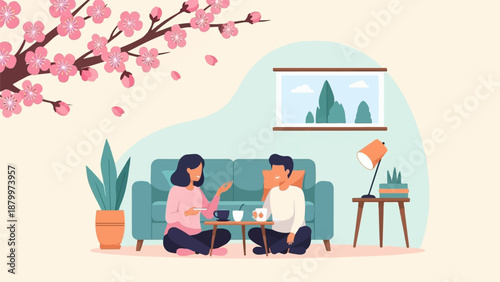 Couple enjoys drinks near a blooming tree in a cozy room setting