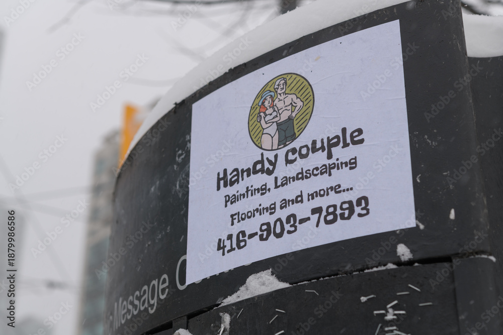 Fototapeta premium Handy Couple paper bill posted to a message board in downtown Toronto