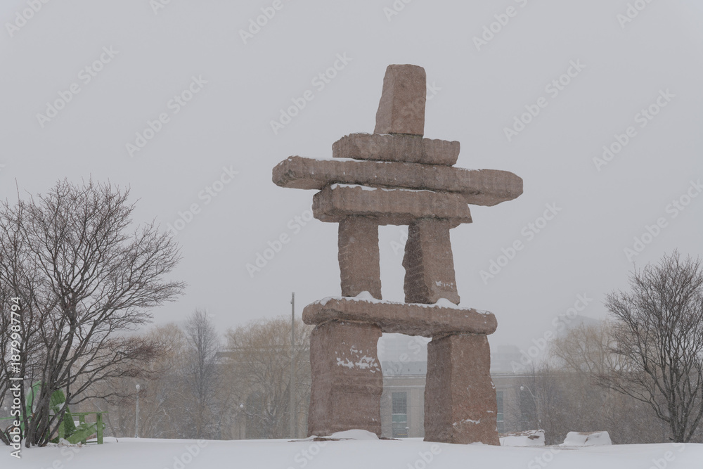 Obraz premium large wayfinding marker at The Toronto Inukshuk Park, 789 Lake Shore Blvd W during a winter storm on 2026-01-15 (south side)