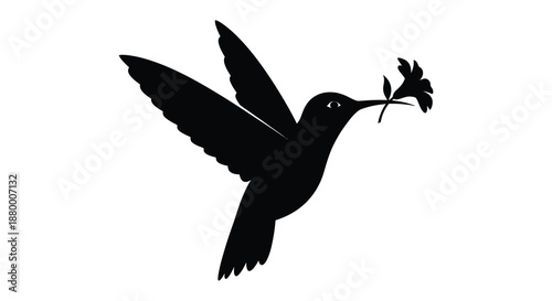 A striking black hummingbird carries a delicate floral sprig in its beak displaying graceful flight and beauty a captivating silhouette