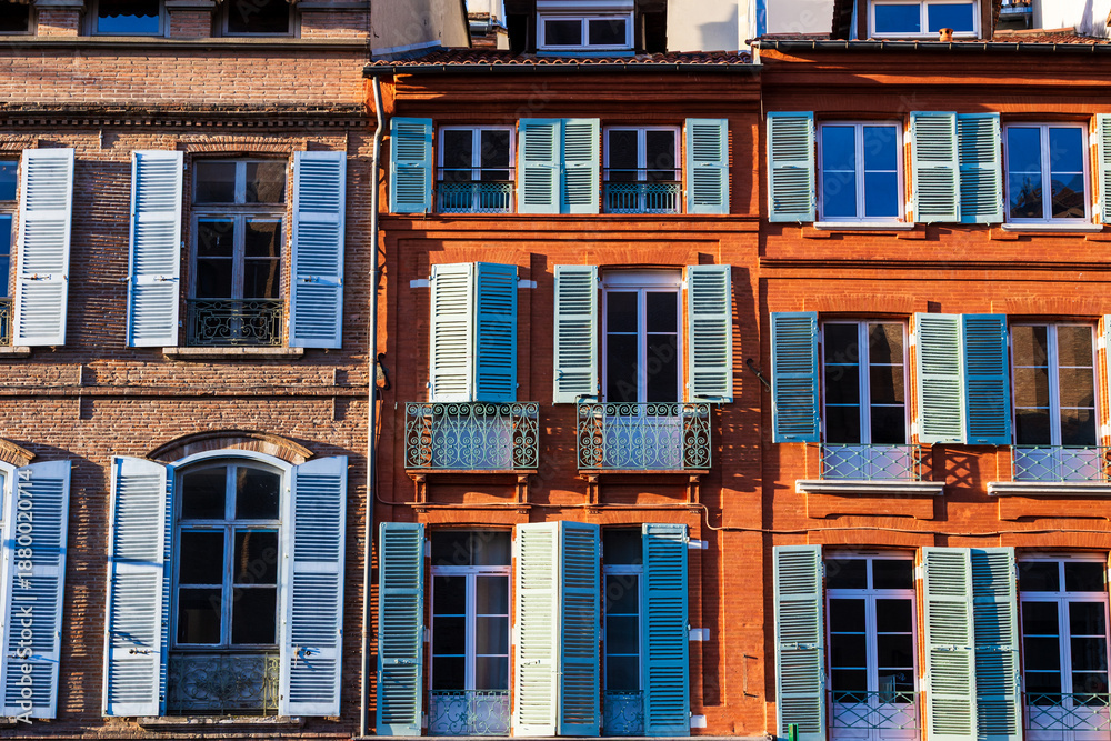 Obraz premium Brick façades facing Place Saint-Etienne illuminated by winter sunlight in central Toulouse