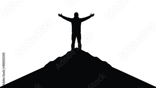 Silhouette of triumphant climber celebrating reaching the summit after a long challenging mountain ascent