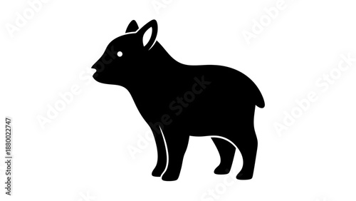 Silhouette of a young goat standing.