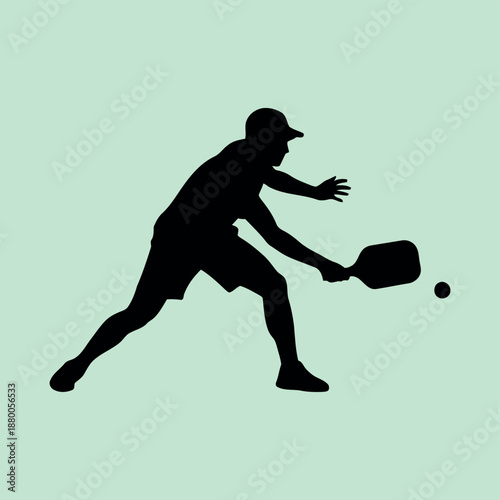 Silhouette of a pickleball player preparing to hit the ball