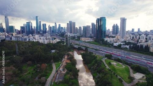Aerial revealing Tel Aviv skyline near Ayalon road fling up looking south in Israel