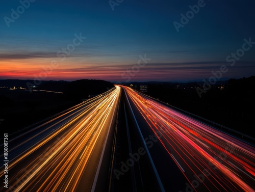 busy highway at dusk with car lights creating vibrant streaks of color