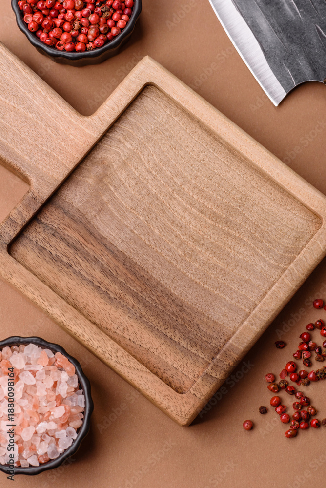 Fototapeta premium Empty wooden cutting board with a knife for food preparation. An empty wooden cutting board