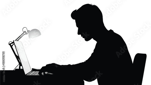 Silhouette of a dedicated student focused intently while working late at night on a laptop computer