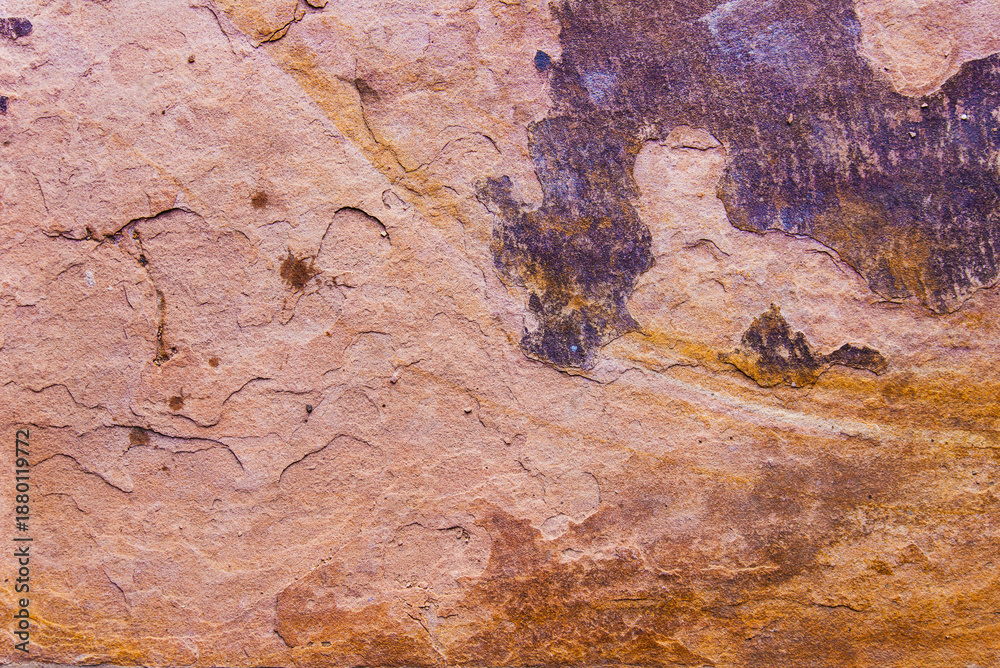Fototapeta premium Earthy sandstone texture with rough surface cracks and abstract mineral patterns