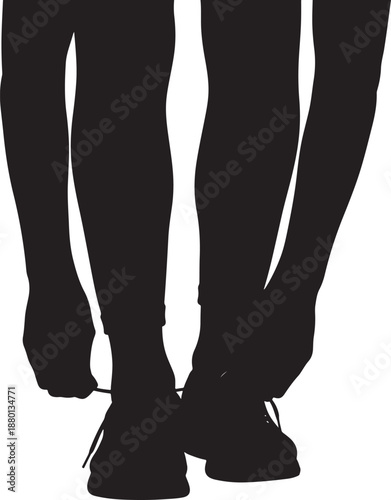 Silhouette of a person bending down to tie their shoelaces before a run or walk