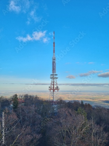 A tall steel structure with mobile network transmitters rising above the landscape. A symbol of modern communication, connectivity, and digital infrastructure.