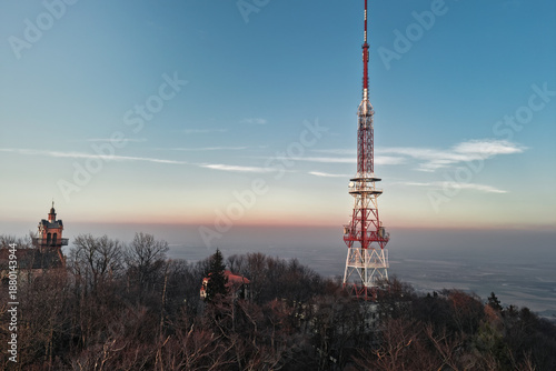 A tall steel structure with mobile network transmitters rising above the landscape. A symbol of modern communication, connectivity, and digital infrastructure.