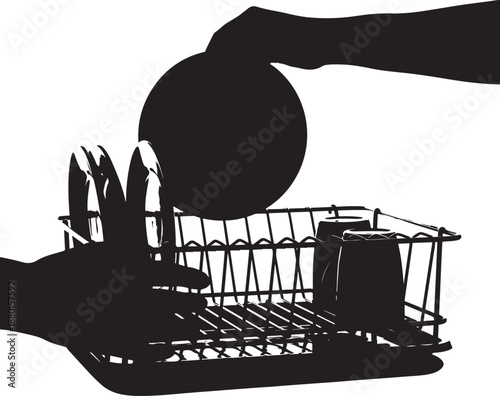 Silhouette of hands placing a clean plate into a wire dish drying rack, kitchen chore concept