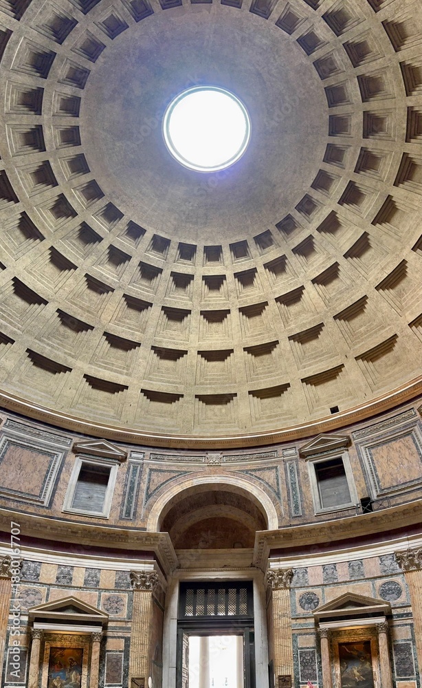 Obraz premium Interior dome of the Pantheon in Rome, ancient Roman temple ceiling with coffered concrete pattern and central oculus opening to the sky, classical architecture landmark and historic monument in Italy