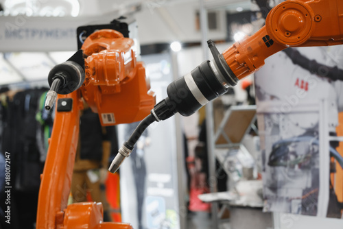 Industrial robotic arms with interchangeable end effectors performing automated welding, cutting, painting, and assembly tasks in advanced manufacturing environments