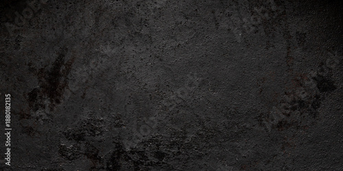 Old dark metal surface with heavy grainy texture and rustic oxidized patina for industrial background