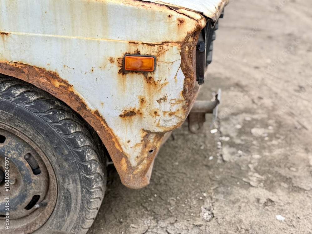 Fototapeta premium Vintage Vehicle Decay, Aged Car Showing Corrosion, Detailed Image Of Deteriorating Vintage Car In Decay Mode, Closeup Photograph Capturing Corrosion And Aging Of Antique Vehicle