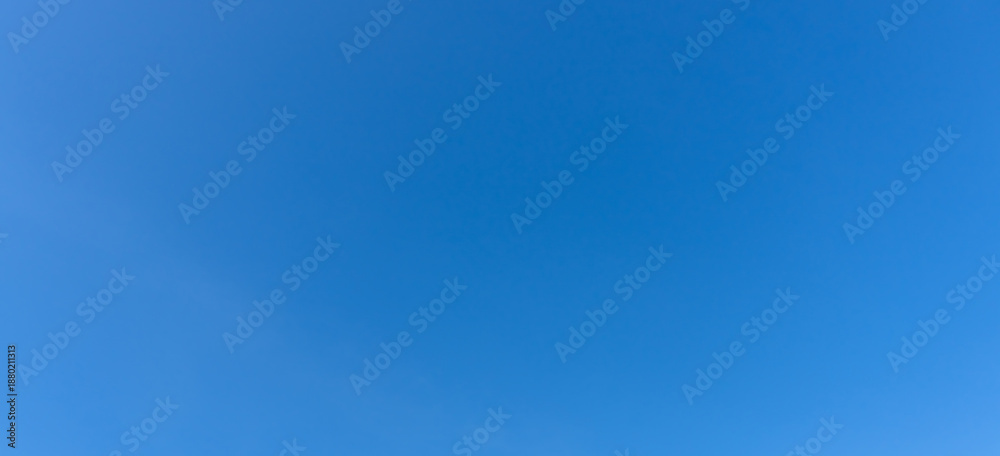 Obraz premium Low angle view and full frame of beautiful light blue sky without clouds in the afternoon on sunny day used as natural background texture in decorative art work