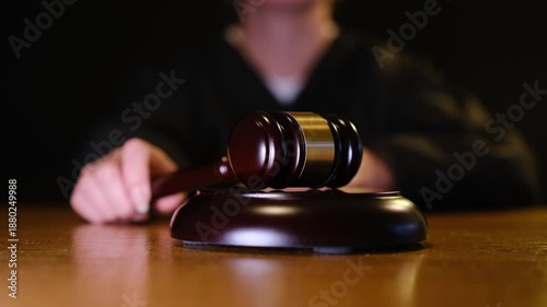 Female judge hitting a gavel in courtroom