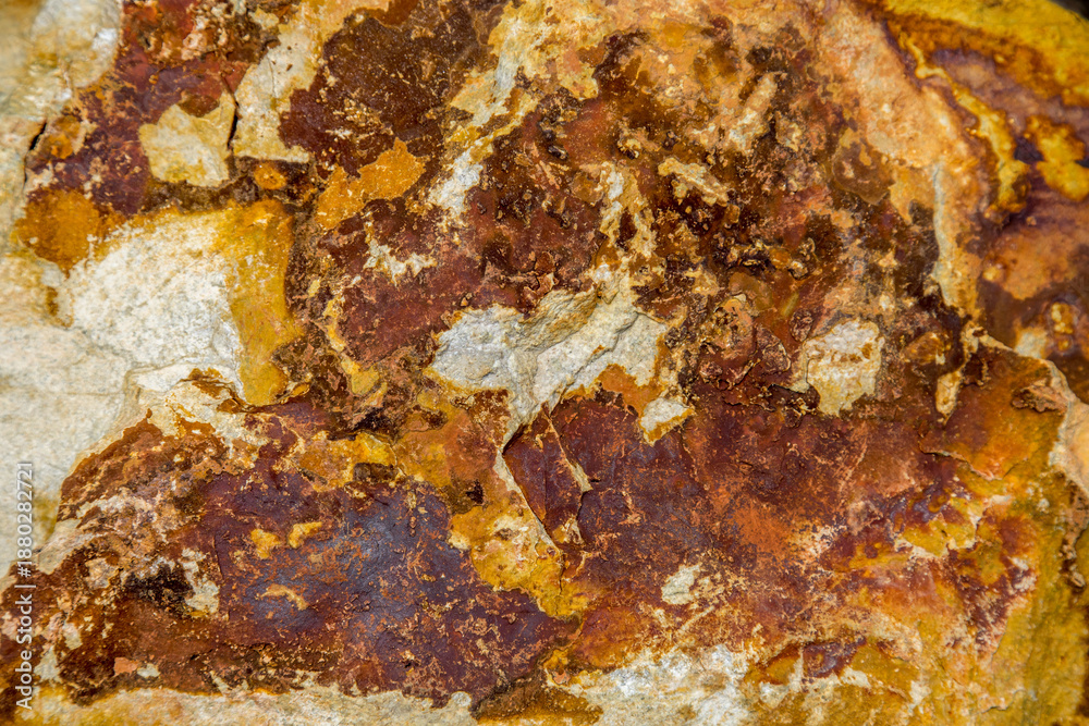 Fototapeta premium Stone structures and grain patterns in reddish brown
