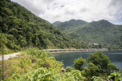wide concrete road along the tropical coastline 