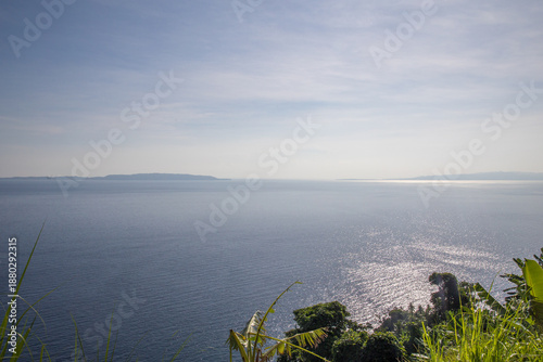 tropical scenery blue ocean blue sky Islands in the Background