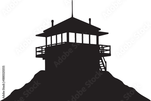 Silhouette of a lookout tower on a mountain peak