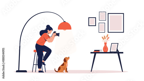 Young female photographer using a professional camera to take a portrait of a small dog in a minimalist home studio setup.