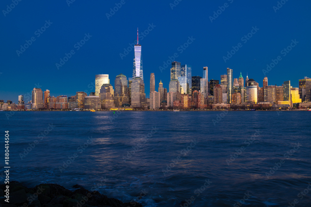 Obraz premium NYC with Manhattan at night. New York skyline in Manhattan. New York city skyline. New York landmark skyline. New York panorama skyline.