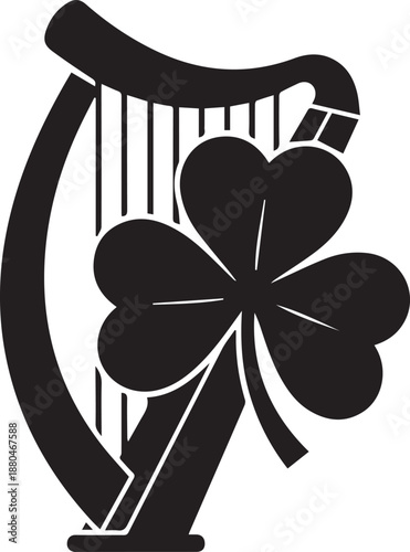 Black silhouette of an irish harp with a shamrock clover leaf