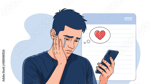 Sad young man crying while looking at his smartphone displaying a broken heart icon indicating a relationship breakup or rejection.