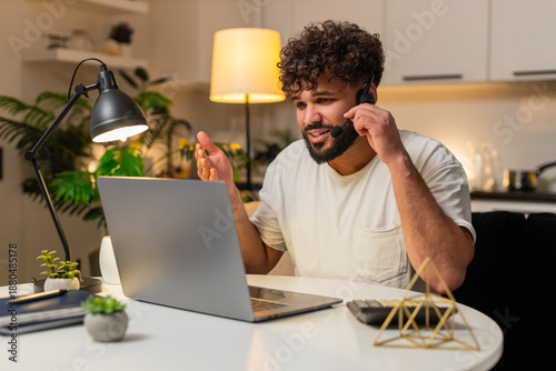 Canvastavla Arabian man at home wears headset answers hotline call types notes opens ticket gives info