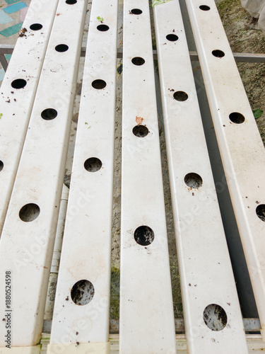 Empty White Hydroponic Growing Pipes In Greenhouse
