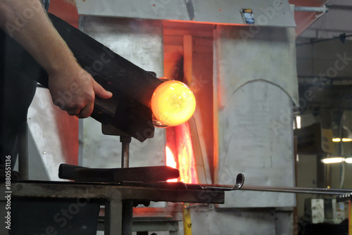 Wallpaper Mural The molten glass at the end of a blowpipe put into a glory hole Torontodigital.ca