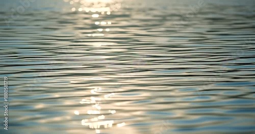 Ripples on Water Surface with Sunlight Reflection.