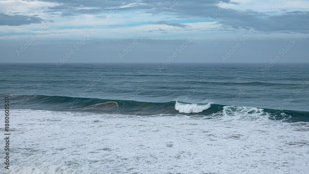 Fototapeta premium the biggest swell of the year hitting the coast line near Imsouane, Morocco wit +10m wave smashing into the rocks and shooting spray 50m in the air.