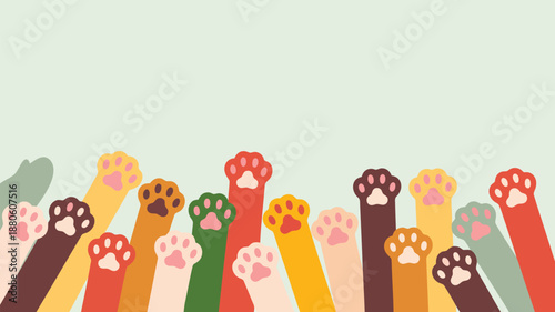 A joyful collection of diverse cat paws in many bright colors reaching upwards towards the empty clear space