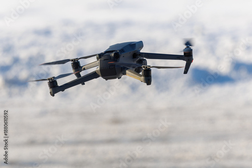 Camera drone flying over snowy landscape close up