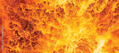 Seamless motion loop of a hot fiery inferno with burning orange flames and red energy texture creating a glowing explosion design on a dark background
