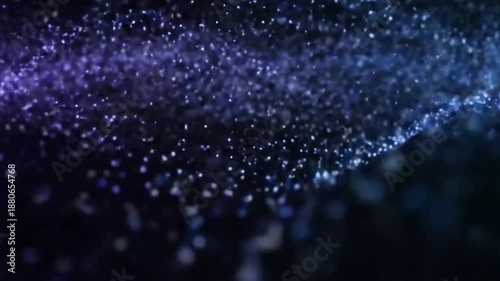 Ethereal Particle Drift Slow, undulating movement of glowing dust-like particles against a deep, dark background.