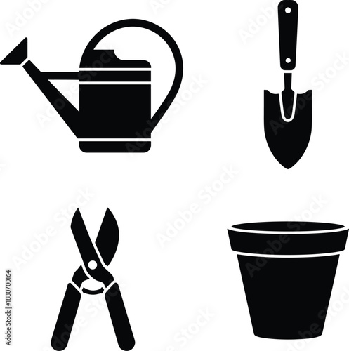 Black and white gardening tools and pot watering can