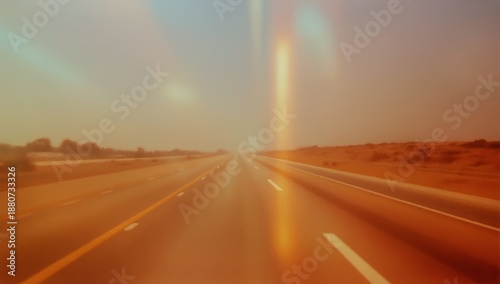 Wide Open Road Stretches Into the Distance Under a Clear Sky at Dusk