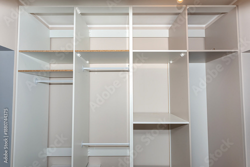 Photos A carpenter assembling a wardrobe in a vestibule, a precise handiwork