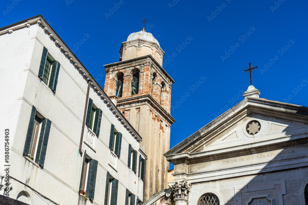 Fototapeta premium Venice, Italy - 10.11.2024: San Simeone Profeta church with bell tower and classical facade in Venice.