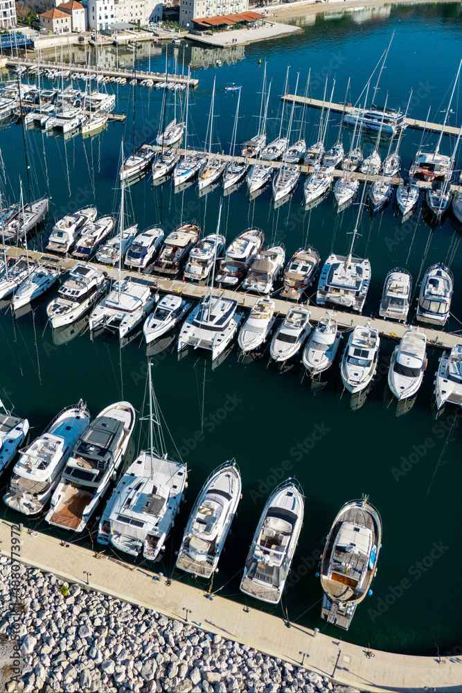 Fototapeta premium Yachts moored to the pier in the marina. Aerial view