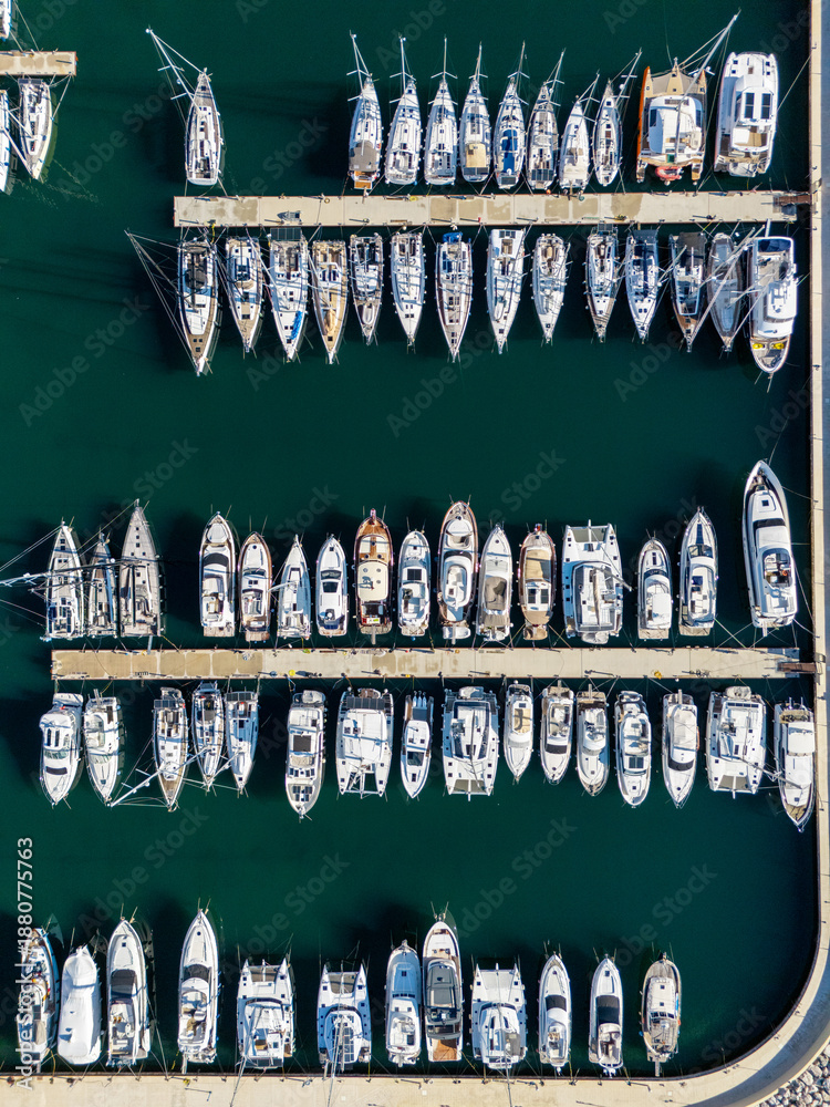 Fototapeta premium Yachts moored to the pier in the marina. Aerial view